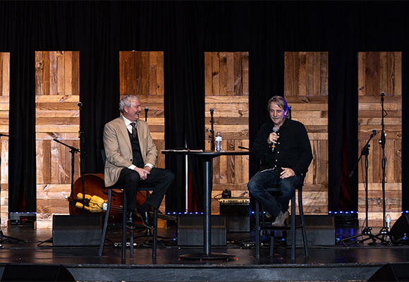 President Shannon speaks with Jeff Foxworthy on Loyd Auditorium stage.