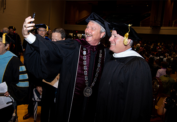 President Shannon takes a selfie with Dave Clouse at tolling of the bell.