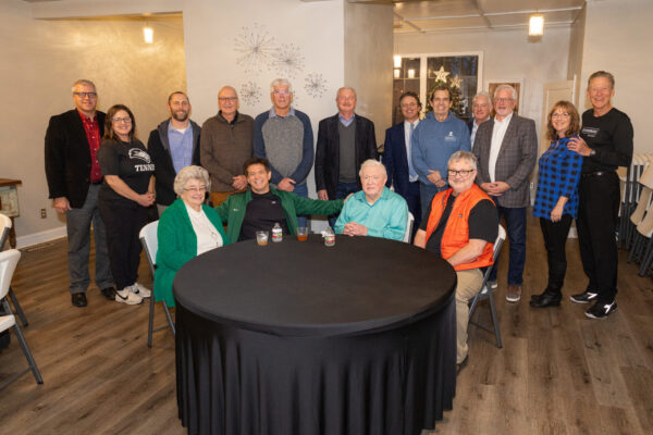 Ann and Doc Woods are surrounded by friends and family as he celebrates his 90th birthday.