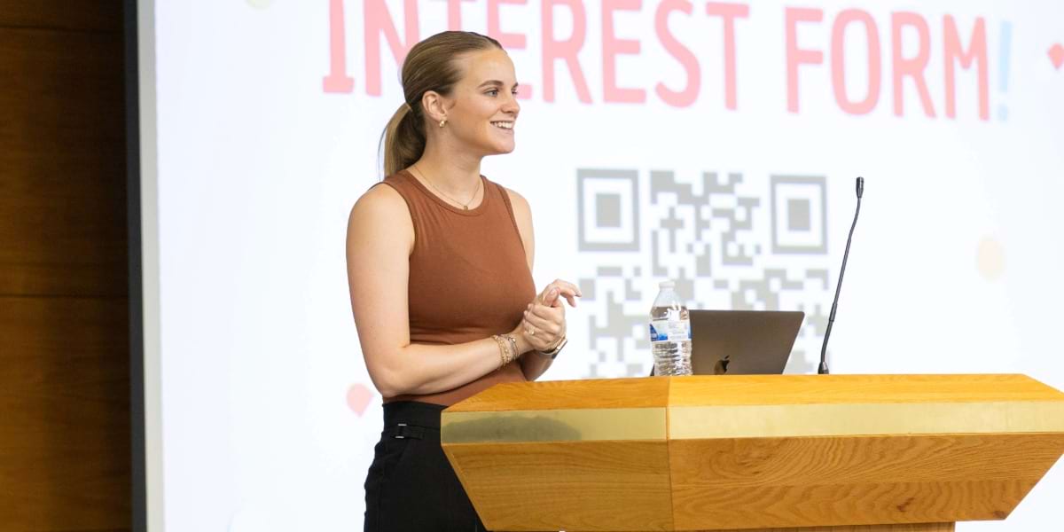 lady leading prescription for success session in front of white board