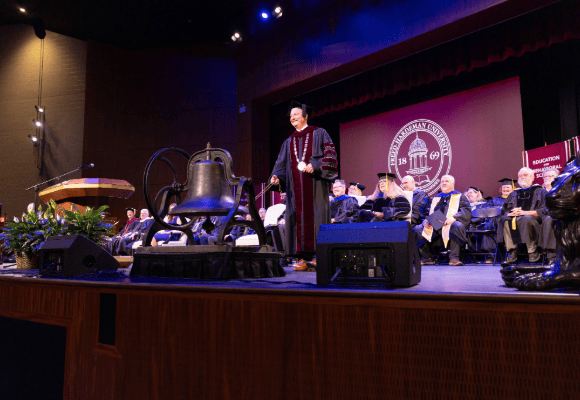 David Shannon tolling the bell to launch the 156th academic year for Freed-Hardeman University.