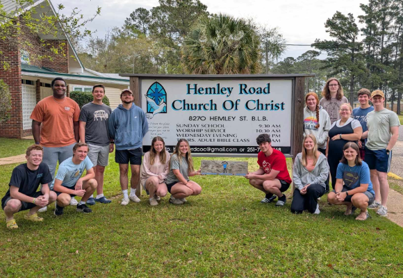 Group of FHU students posing outside the Hemley Road Church of Christ