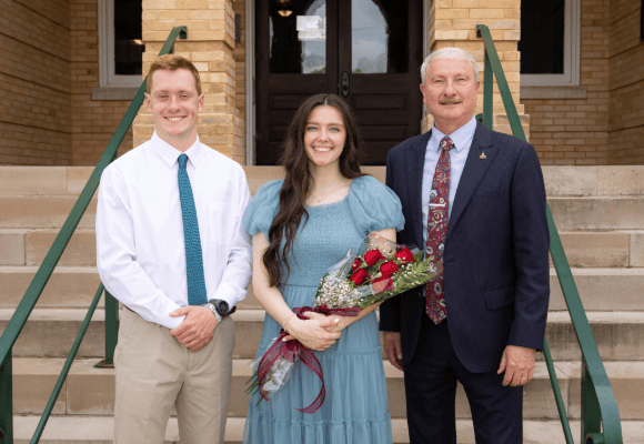 David Shannon posing with Mr and Miss FHU
