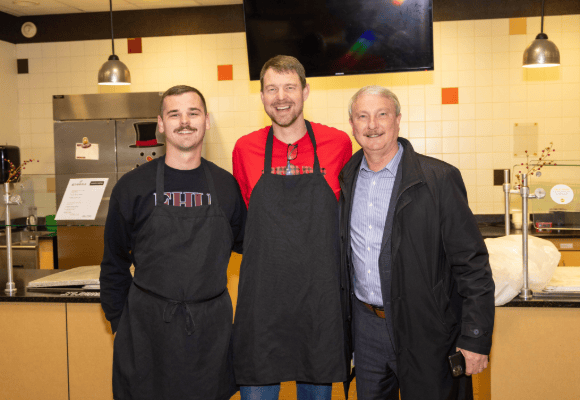 David Shannon posing with staff in the late Gano Dining Hall for the finals breakfast
