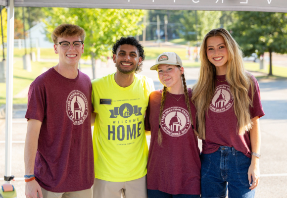 Students with admissions staff during Welcome Home