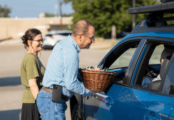 FHU Staff greeting new students as they arrive at Freed-Hardeman