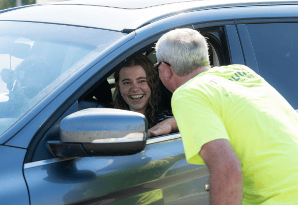 David Shannon greeting a new student as they arrive at Freed-Hardeman