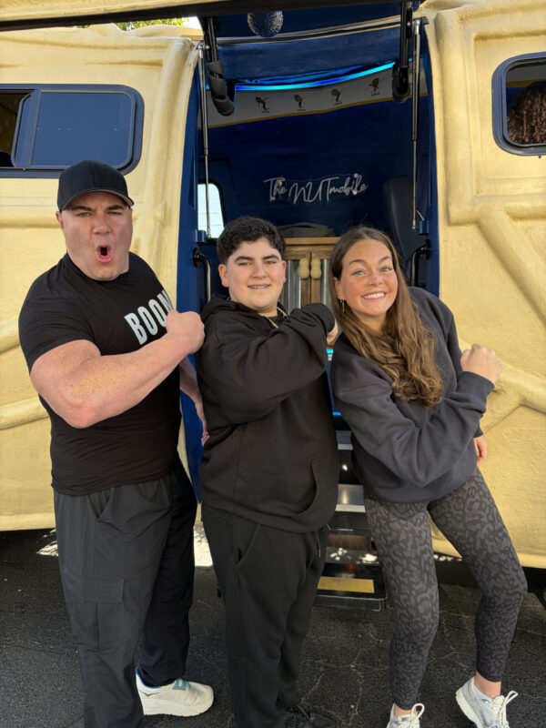 FHU alumna Adleigh Mayes poses with Costco team members during the Super Bowl LXI.