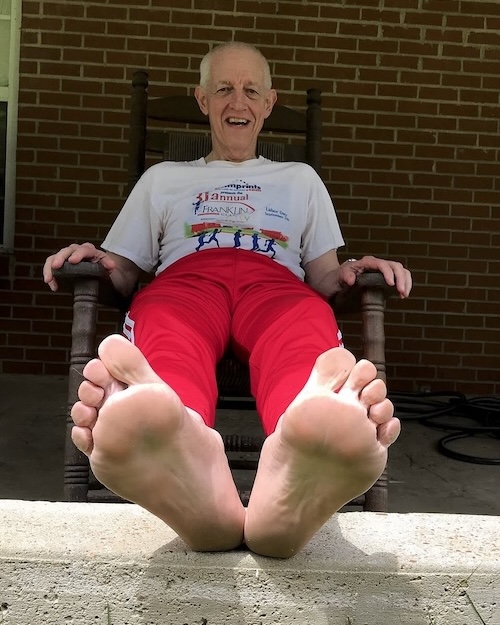 Jerrie Barber props his feet up