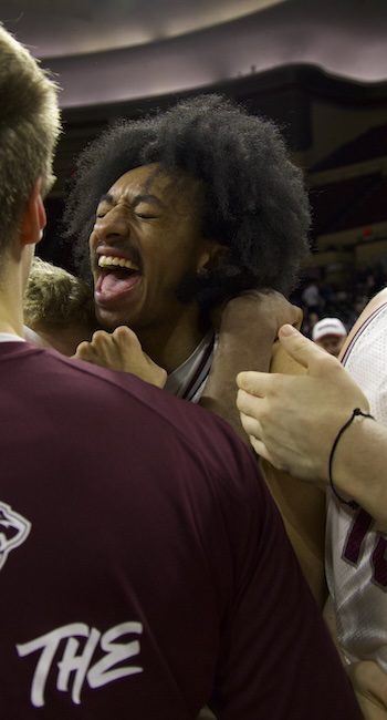 Basketball players celebrating as they won