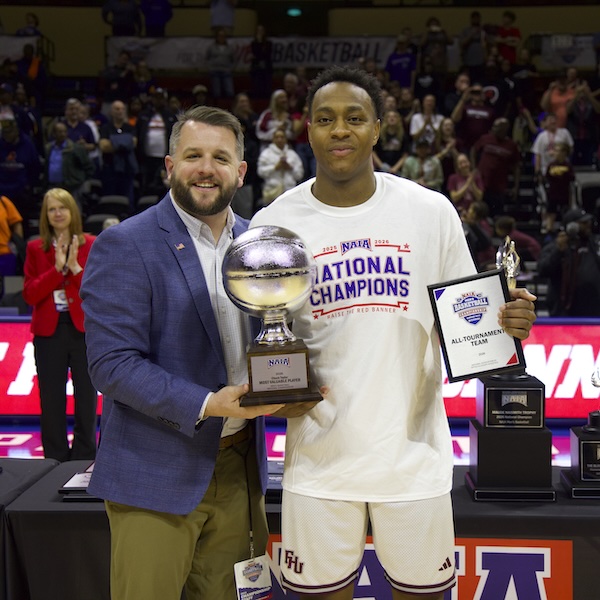 FHU receiving the trophy after winning the 2026 NAIA National Championship