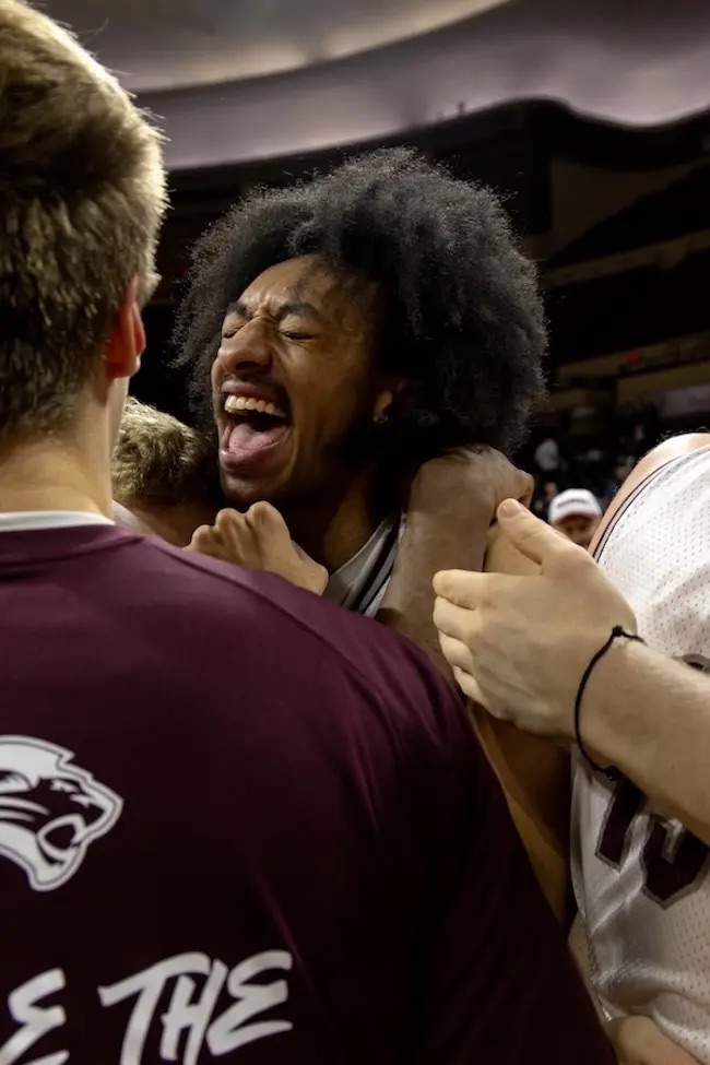 Basketball players celebrating as they won