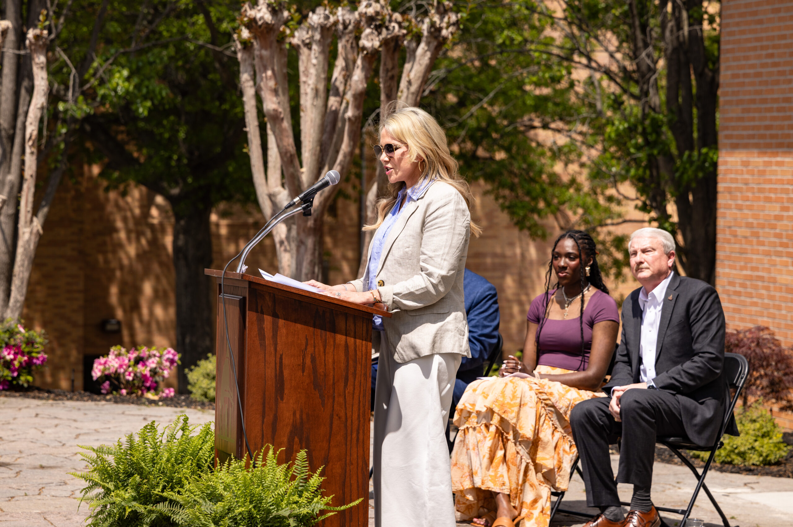 FHU Board of Trustee member Dayla Calendine addresses the crowd gathered during the ribbon cutting celebrating the Calendine-Davis Photo Studio.