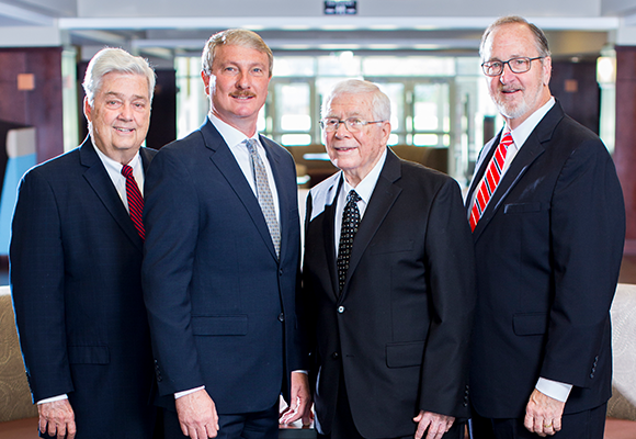 President Shannon stands with three previous presidents of Freed-Hardeman University.
