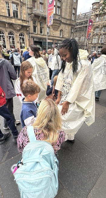 FHU theatre students talk to children on the streets of Edinburgh