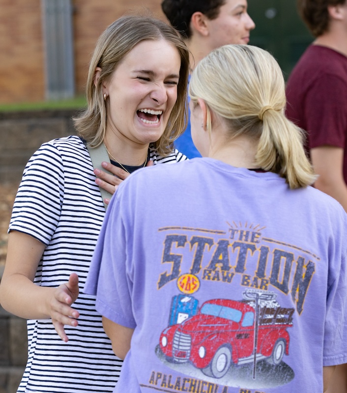 two girls laughing together