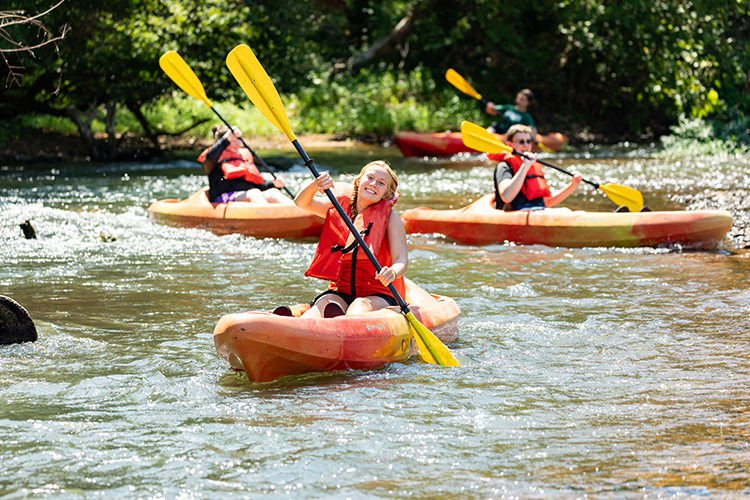 student kayaking on the buffalo river