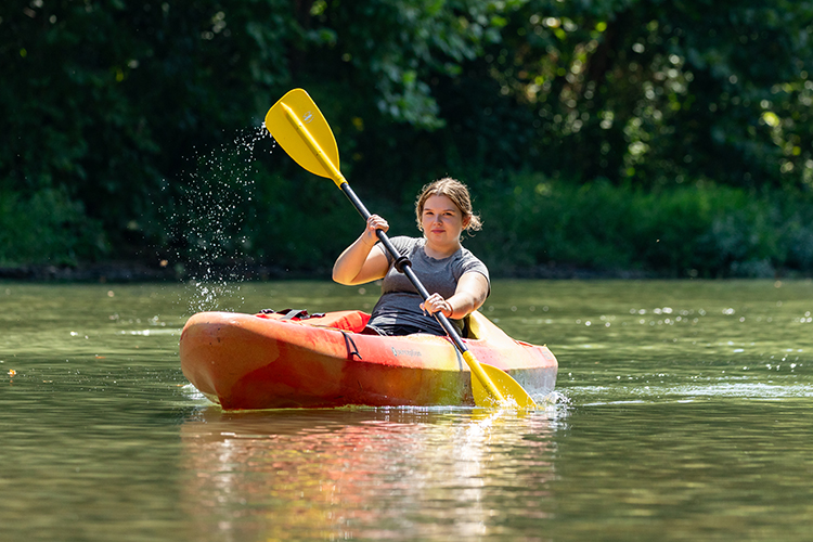 student kayaking on the buffalo river