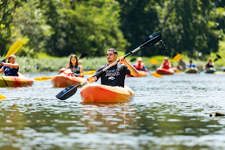 student kayaking on the buffalo river