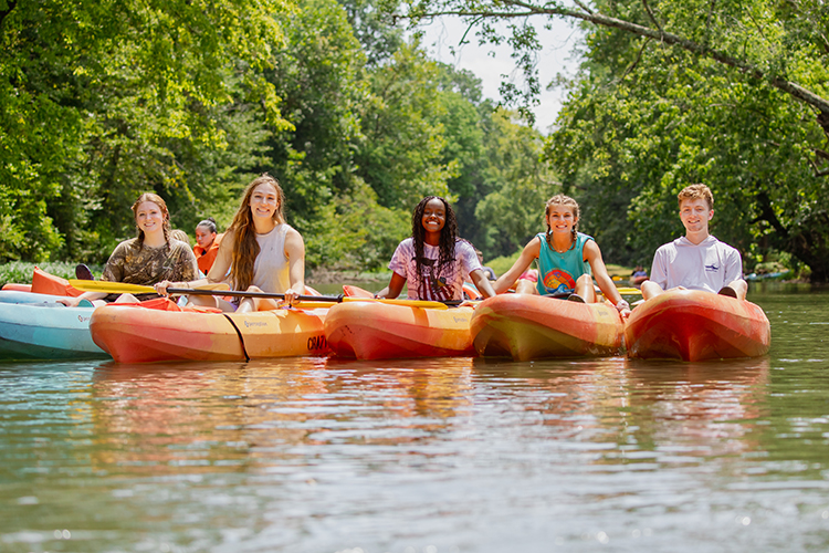 student kayaking on the buffalo river