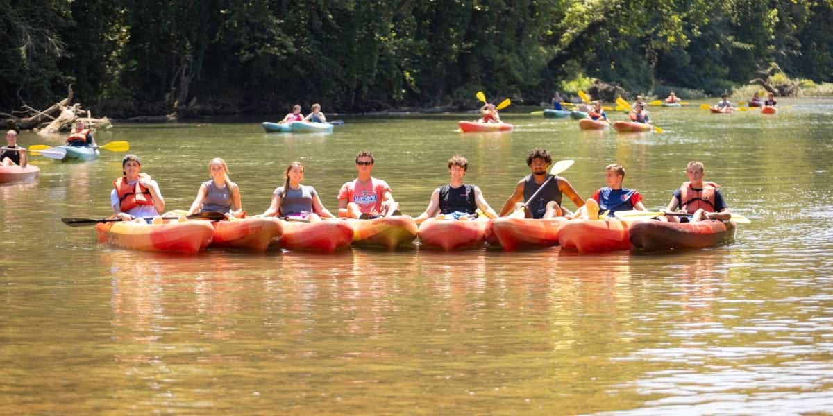 a line of students in kayaks on the Buffalo River