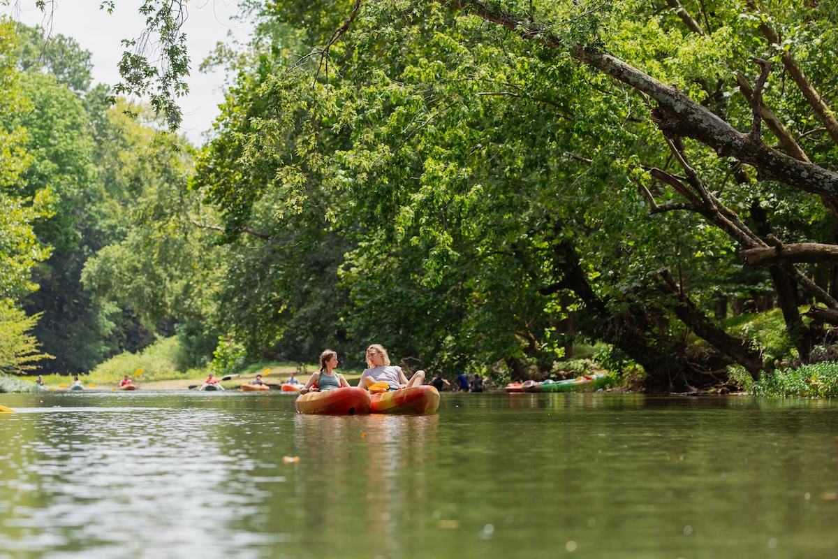 student kayaking on the buffalo river