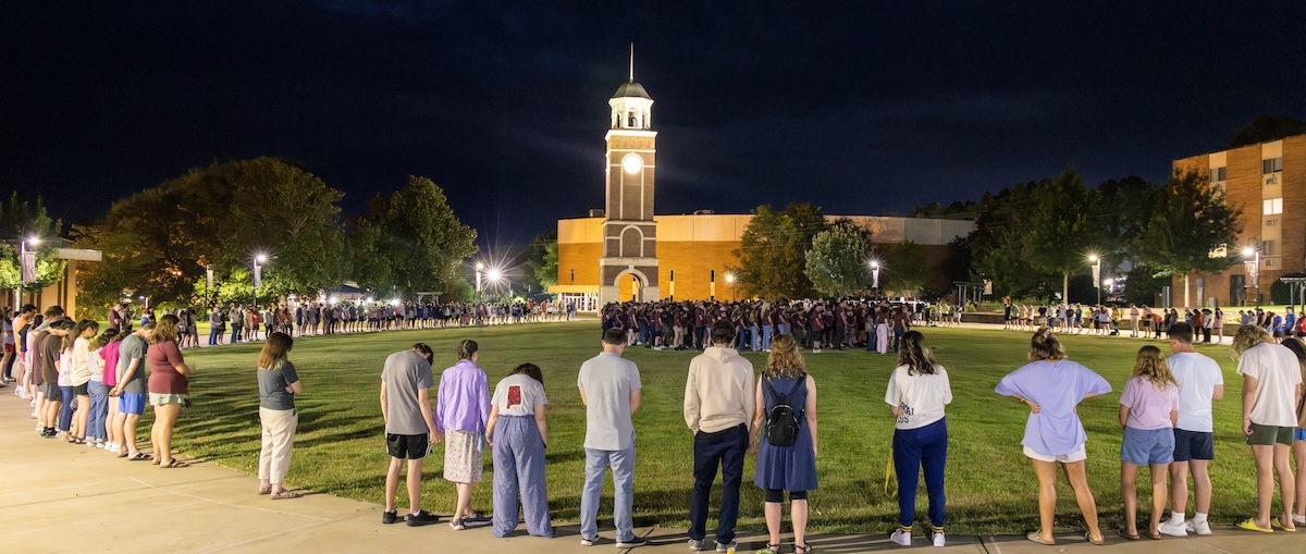 students praying in commons