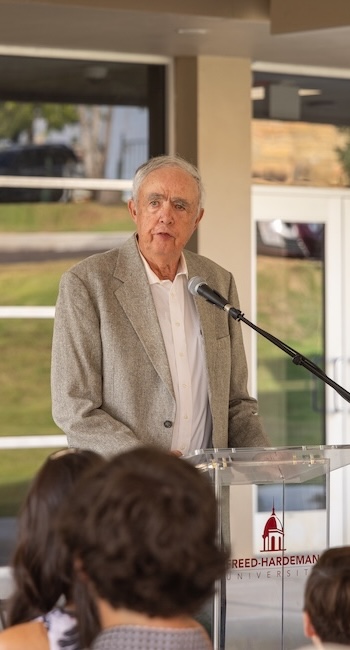 Jimmy Dryden speaks to audience during Dryden Auditorium ribbon cutting.