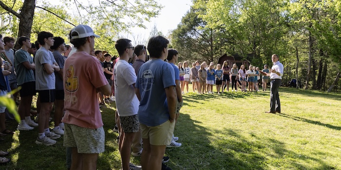 Keith Harris outside talking to a group of FHU students