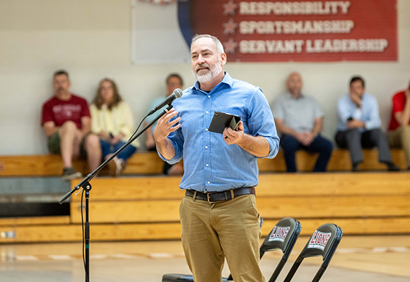 man giving a talk for mission emphasis day