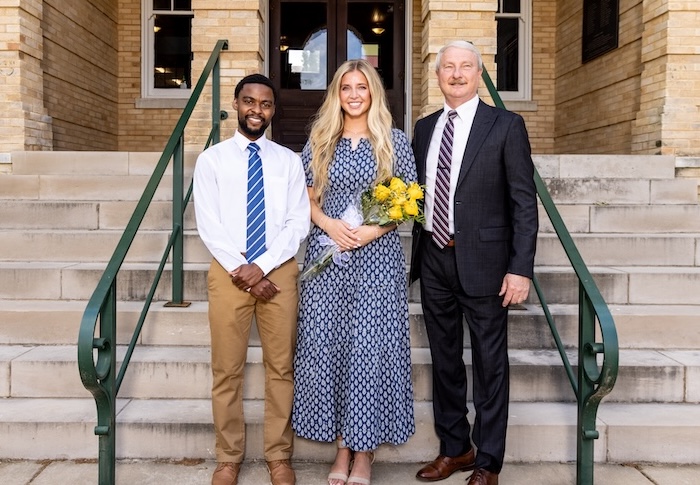 Mr. and Miss FHU stand with President Shannon on the steps of Old Main.