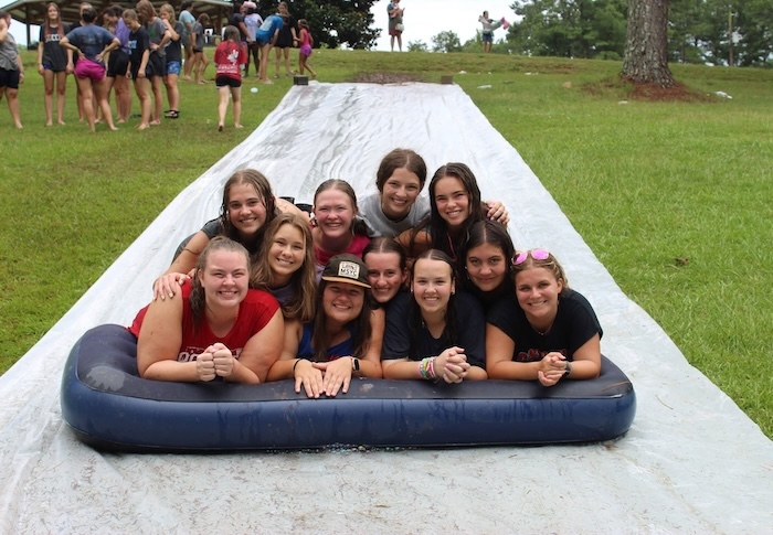 Mid-South Youth Camp counselors and staff on the slip-n-slide