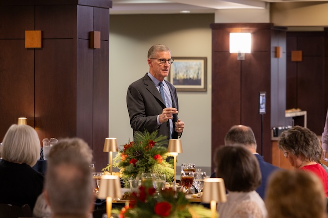Gen. Stanley McChrystal greets guests in the library