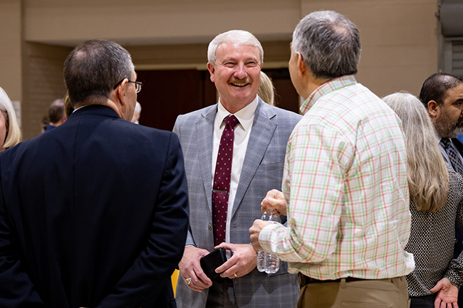 President David Shannon talking to two men