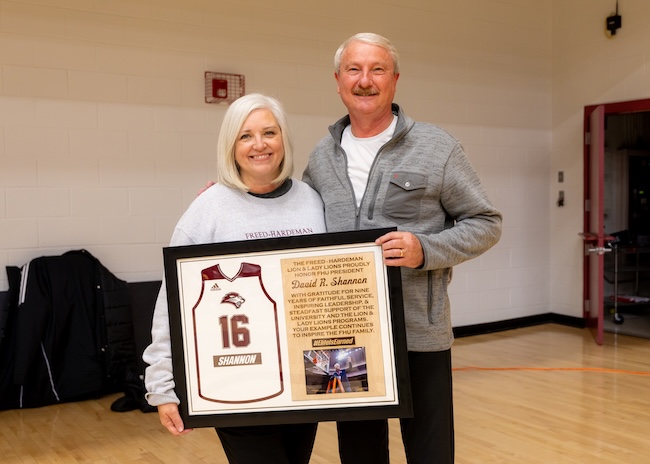 David and Tracie Shannon with a plaque from the FHU basketball teams