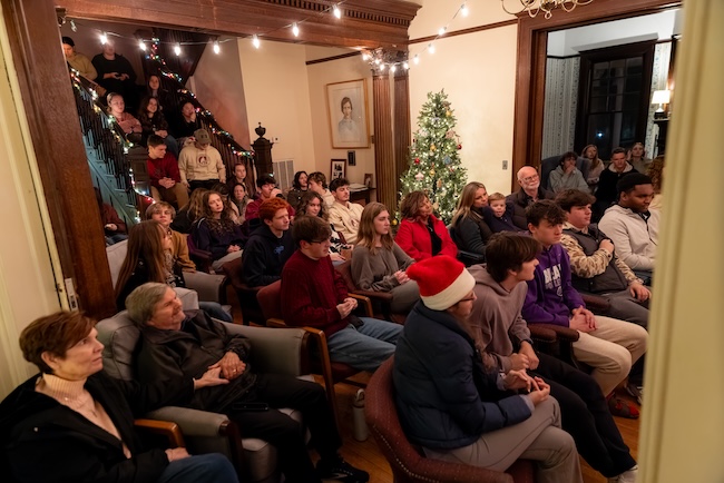 FHU students and guests sit in the foyer of the McDaniel House