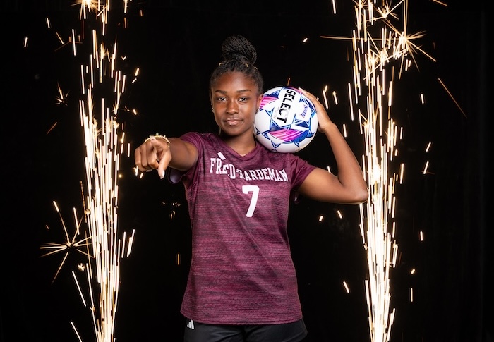FHU women's soccer player with ball