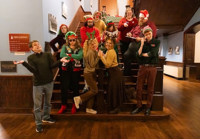 Cast of the holiday murder mystery poses in costume