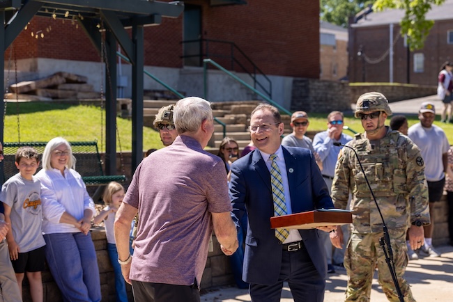Henderson Mayor Terry Bell congratulates President David Shannon on his successful tenure at FHU.