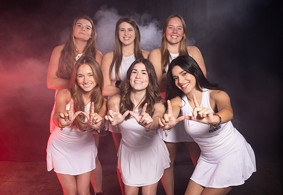 tennis team girls posing