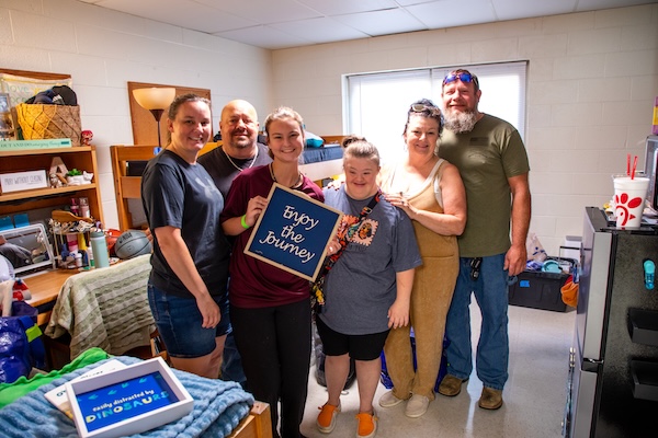 Family moving into dorm room